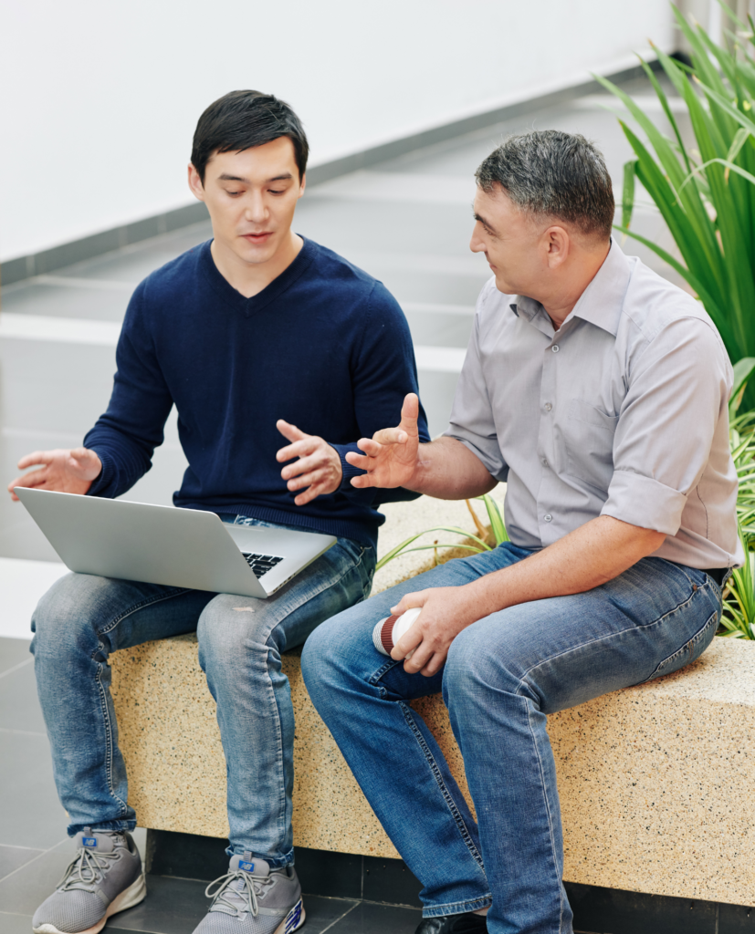 Two people talking, mentorship and coaching.